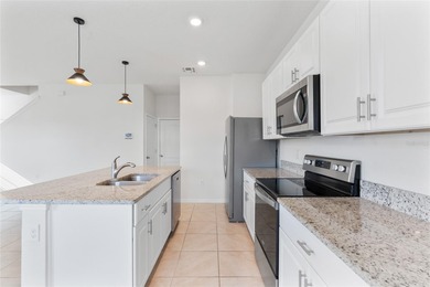 Situated on a corner lot, this contemporary two-story home with on Venetian Bay Golf Course in Florida - for sale on GolfHomes.com, golf home, golf lot