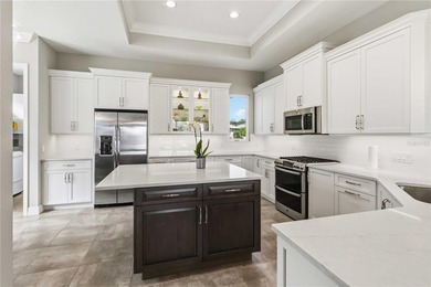 This beautifully enhanced WATER VIEW Augusta model set within on Rosedale Golf and Tennis Club in Florida - for sale on GolfHomes.com, golf home, golf lot