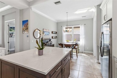 This beautifully enhanced WATER VIEW Augusta model set within on Rosedale Golf and Tennis Club in Florida - for sale on GolfHomes.com, golf home, golf lot