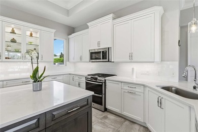 This beautifully enhanced WATER VIEW Augusta model set within on Rosedale Golf and Tennis Club in Florida - for sale on GolfHomes.com, golf home, golf lot