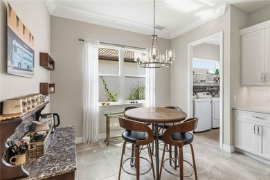 This beautifully enhanced WATER VIEW Augusta model set within on Rosedale Golf and Tennis Club in Florida - for sale on GolfHomes.com, golf home, golf lot