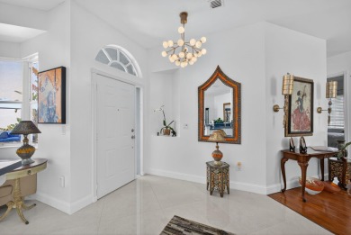 Rarely available single-story courtyard home perfectly situated on  in Florida - for sale on GolfHomes.com, golf home, golf lot