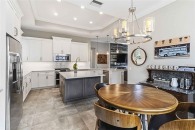 This beautifully enhanced WATER VIEW Augusta model set within on Rosedale Golf and Tennis Club in Florida - for sale on GolfHomes.com, golf home, golf lot