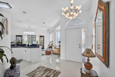 Rarely available single-story courtyard home perfectly situated on  in Florida - for sale on GolfHomes.com, golf home, golf lot