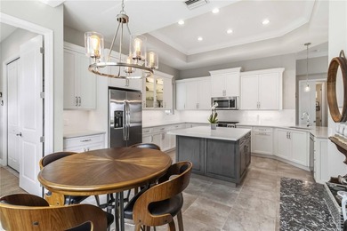 This beautifully enhanced WATER VIEW Augusta model set within on Rosedale Golf and Tennis Club in Florida - for sale on GolfHomes.com, golf home, golf lot