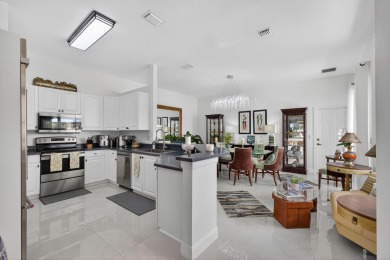 Rarely available single-story courtyard home perfectly situated on  in Florida - for sale on GolfHomes.com, golf home, golf lot