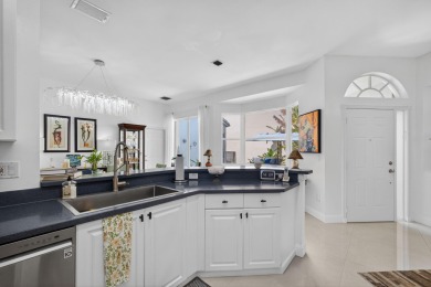 Rarely available single-story courtyard home perfectly situated on  in Florida - for sale on GolfHomes.com, golf home, golf lot