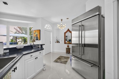 Rarely available single-story courtyard home perfectly situated on  in Florida - for sale on GolfHomes.com, golf home, golf lot