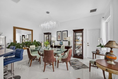 Rarely available single-story courtyard home perfectly situated on  in Florida - for sale on GolfHomes.com, golf home, golf lot