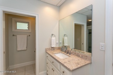 Experience the pinnacle of lakefront living in this immaculate on Beacon Ridge Golf and Country Club in North Carolina - for sale on GolfHomes.com, golf home, golf lot