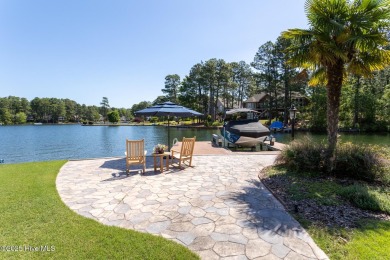 Experience the pinnacle of lakefront living in this immaculate on Beacon Ridge Golf and Country Club in North Carolina - for sale on GolfHomes.com, golf home, golf lot