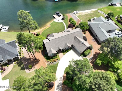 Experience the pinnacle of lakefront living in this immaculate on Beacon Ridge Golf and Country Club in North Carolina - for sale on GolfHomes.com, golf home, golf lot