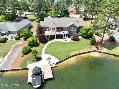 Experience the pinnacle of lakefront living in this immaculate on Beacon Ridge Golf and Country Club in North Carolina - for sale on GolfHomes.com, golf home, golf lot