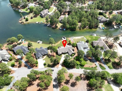 Experience the pinnacle of lakefront living in this immaculate on Beacon Ridge Golf and Country Club in North Carolina - for sale on GolfHomes.com, golf home, golf lot