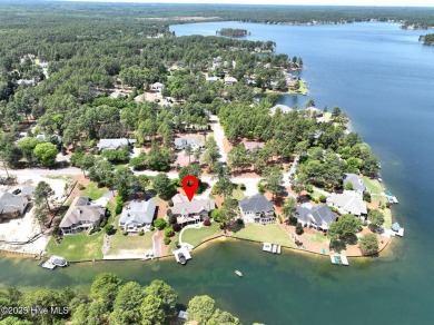 Experience the pinnacle of lakefront living in this immaculate on Beacon Ridge Golf and Country Club in North Carolina - for sale on GolfHomes.com, golf home, golf lot