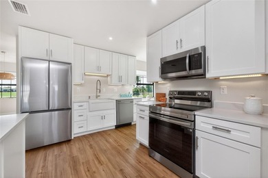 Modern Luxury Meets Beautiful Pond and Golf Course Views in This on Rotonda Golf and Country Club The Hills Course in Florida - for sale on GolfHomes.com, golf home, golf lot