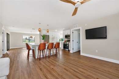 Modern Luxury Meets Beautiful Pond and Golf Course Views in This on Rotonda Golf and Country Club The Hills Course in Florida - for sale on GolfHomes.com, golf home, golf lot