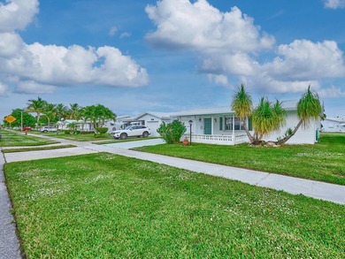This is the largest 2/2/1 w/ the BONUS covered front porch on Leisureville Community Golf Course in Florida - for sale on GolfHomes.com, golf home, golf lot