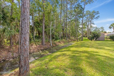 Welcome to 13 Elder Drive, Palm Coast - A Modern Masterpiece in on The Grand Club Cypress Course in Florida - for sale on GolfHomes.com, golf home, golf lot