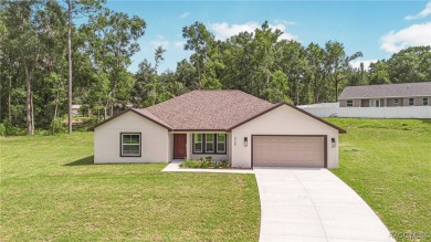 Crafted by an award-winning builder, this Citrus Springs home on Citrus Springs Country Club in Florida - for sale on GolfHomes.com, golf home, golf lot