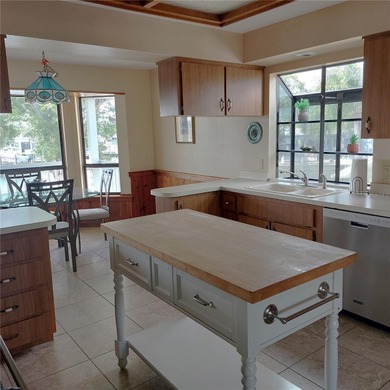 This Key West style Elevated home did not flood during hurricane on Gulf Harbors Golf Course in Florida - for sale on GolfHomes.com, golf home, golf lot