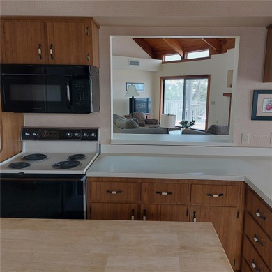 This Key West style Elevated home did not flood during hurricane on Gulf Harbors Golf Course in Florida - for sale on GolfHomes.com, golf home, golf lot