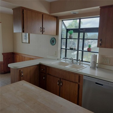 This Key West style Elevated home did not flood during hurricane on Gulf Harbors Golf Course in Florida - for sale on GolfHomes.com, golf home, golf lot