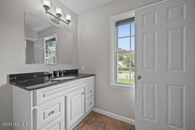 Charming 4-bedroom, 3-bath home located in the heart of on Jacksonville Country Club in North Carolina - for sale on GolfHomes.com, golf home, golf lot