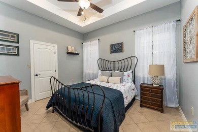 Experience refined lakefront living in this beautifully on South Padre Island Golf Club in Texas - for sale on GolfHomes.com, golf home, golf lot