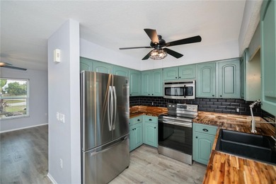 BEAUTIFULLY UPDATED CORNER LOT CHARMER with MAJOR UPDATES! on Oyster Creek Golf Club in Florida - for sale on GolfHomes.com, golf home, golf lot