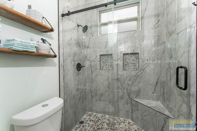 Experience refined lakefront living in this beautifully on South Padre Island Golf Club in Texas - for sale on GolfHomes.com, golf home, golf lot