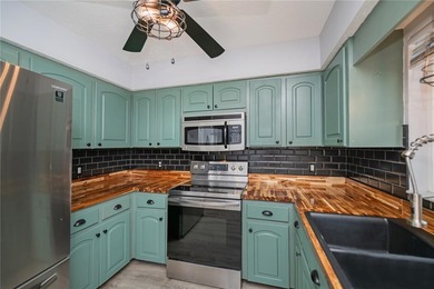 BEAUTIFULLY UPDATED CORNER LOT CHARMER with MAJOR UPDATES! on Oyster Creek Golf Club in Florida - for sale on GolfHomes.com, golf home, golf lot