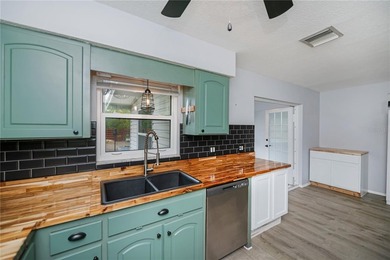 BEAUTIFULLY UPDATED CORNER LOT CHARMER with MAJOR UPDATES! on Oyster Creek Golf Club in Florida - for sale on GolfHomes.com, golf home, golf lot