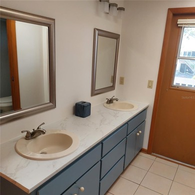 This Key West style Elevated home did not flood during hurricane on Gulf Harbors Golf Course in Florida - for sale on GolfHomes.com, golf home, golf lot