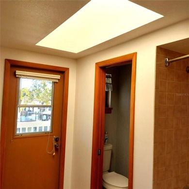 This Key West style Elevated home did not flood during hurricane on Gulf Harbors Golf Course in Florida - for sale on GolfHomes.com, golf home, golf lot