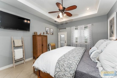 Experience refined lakefront living in this beautifully on South Padre Island Golf Club in Texas - for sale on GolfHomes.com, golf home, golf lot