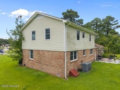 Charming 4-bedroom, 3-bath home located in the heart of on Jacksonville Country Club in North Carolina - for sale on GolfHomes.com, golf home, golf lot