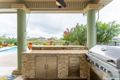 Experience refined lakefront living in this beautifully on South Padre Island Golf Club in Texas - for sale on GolfHomes.com, golf home, golf lot