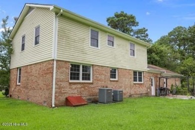 Charming 4-bedroom, 3-bath home located in the heart of on Jacksonville Country Club in North Carolina - for sale on GolfHomes.com, golf home, golf lot