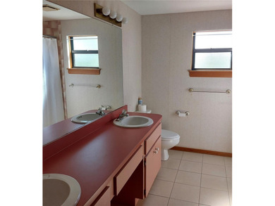 This Key West style Elevated home did not flood during hurricane on Gulf Harbors Golf Course in Florida - for sale on GolfHomes.com, golf home, golf lot