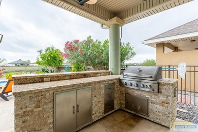 Experience refined lakefront living in this beautifully on South Padre Island Golf Club in Texas - for sale on GolfHomes.com, golf home, golf lot