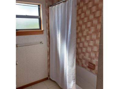 This Key West style Elevated home did not flood during hurricane on Gulf Harbors Golf Course in Florida - for sale on GolfHomes.com, golf home, golf lot