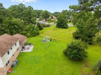 Charming 4-bedroom, 3-bath home located in the heart of on Jacksonville Country Club in North Carolina - for sale on GolfHomes.com, golf home, golf lot