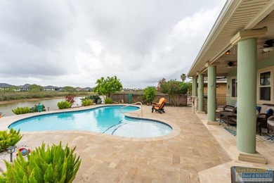 Experience refined lakefront living in this beautifully on South Padre Island Golf Club in Texas - for sale on GolfHomes.com, golf home, golf lot