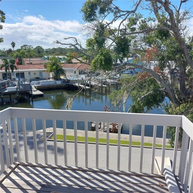 This Key West style Elevated home did not flood during hurricane on Gulf Harbors Golf Course in Florida - for sale on GolfHomes.com, golf home, golf lot