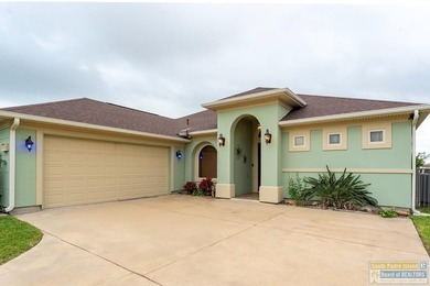 Experience refined lakefront living in this beautifully on South Padre Island Golf Club in Texas - for sale on GolfHomes.com, golf home, golf lot