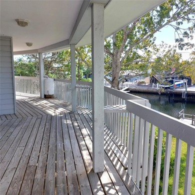 This Key West style Elevated home did not flood during hurricane on Gulf Harbors Golf Course in Florida - for sale on GolfHomes.com, golf home, golf lot