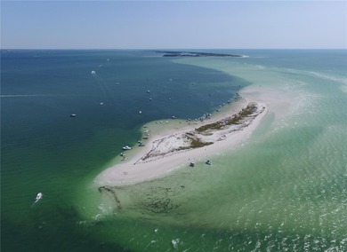 This Key West style Elevated home did not flood during hurricane on Gulf Harbors Golf Course in Florida - for sale on GolfHomes.com, golf home, golf lot