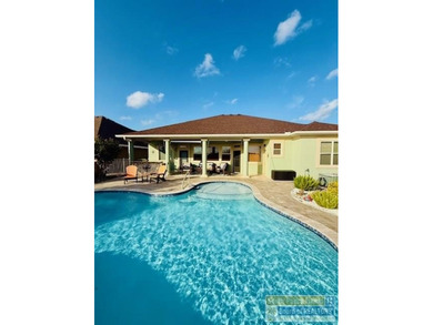 Experience refined lakefront living in this beautifully on South Padre Island Golf Club in Texas - for sale on GolfHomes.com, golf home, golf lot