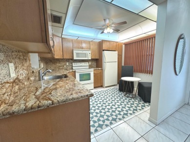 **DRASTIC REDUCTION** GATED, GOLF COMMUNITY WITH THEATER on Wynmoor Golf Course in Florida - for sale on GolfHomes.com, golf home, golf lot